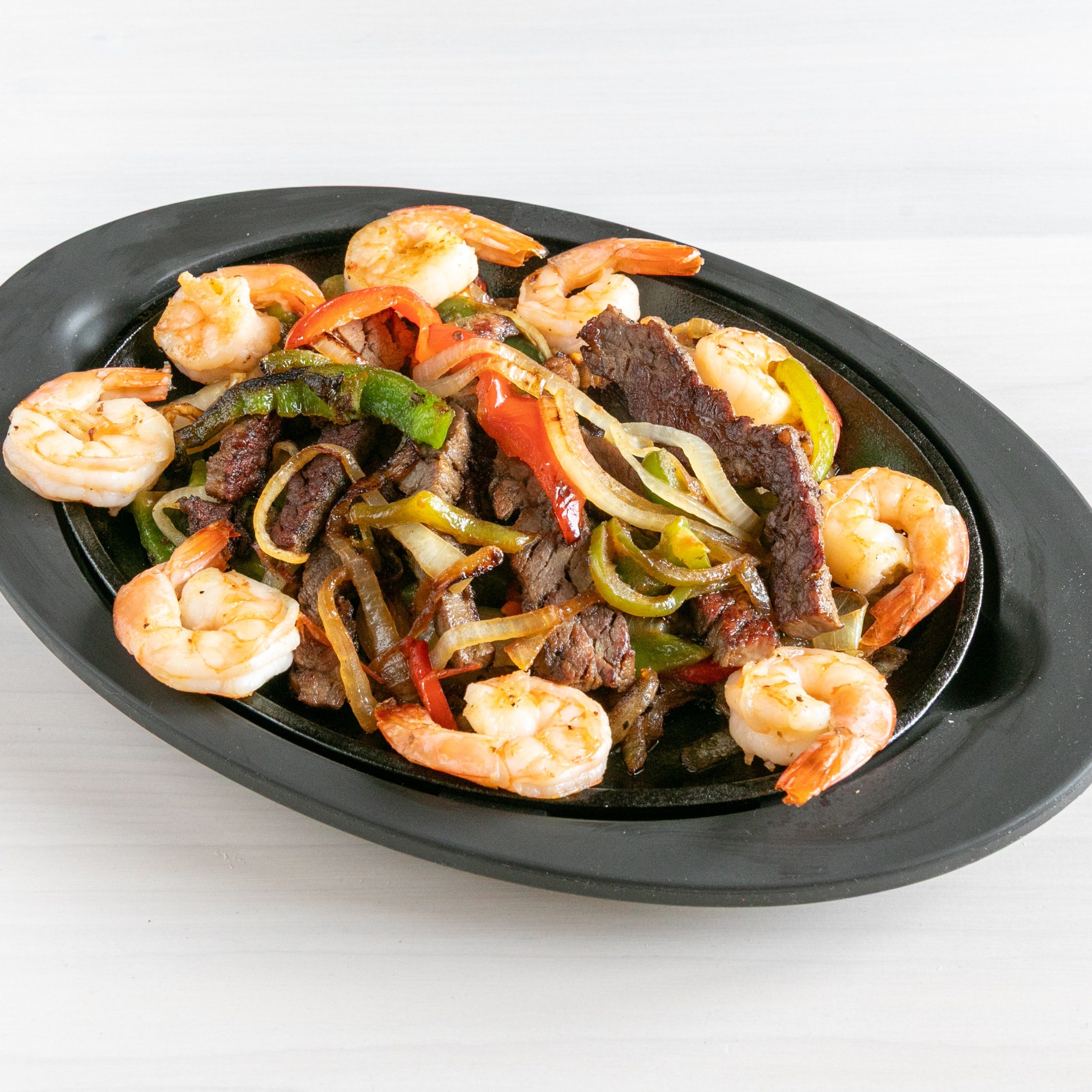 Combination Chicken, Beef and Shrimp Fajita.